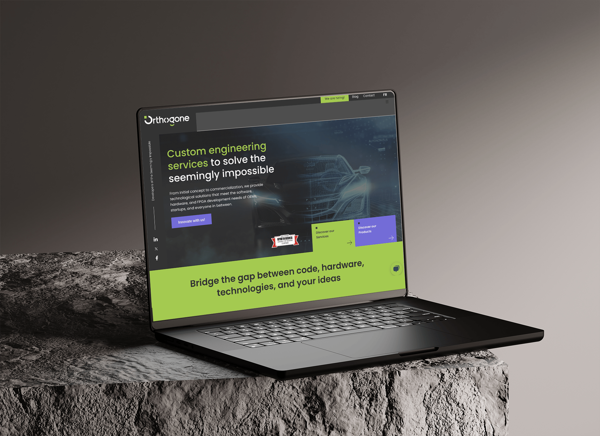 Laptop with Orthogone home page showing in it.
