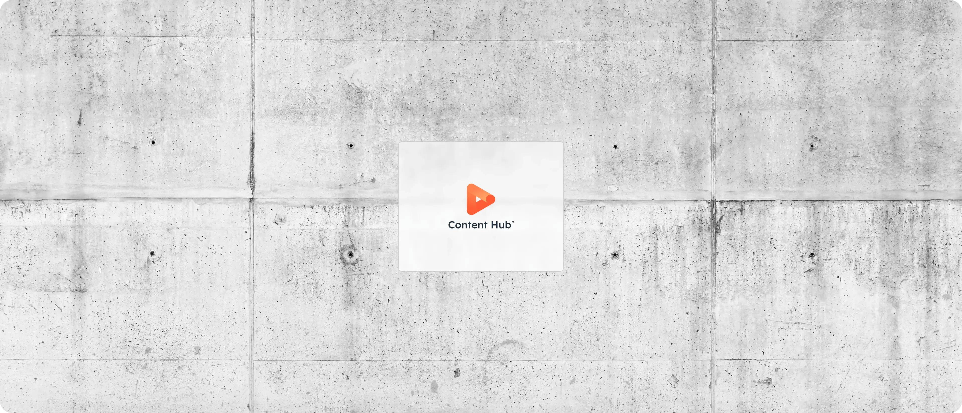 Une icônes de hub de HubSpot : Content Hub, sur un fond texturé de béton
