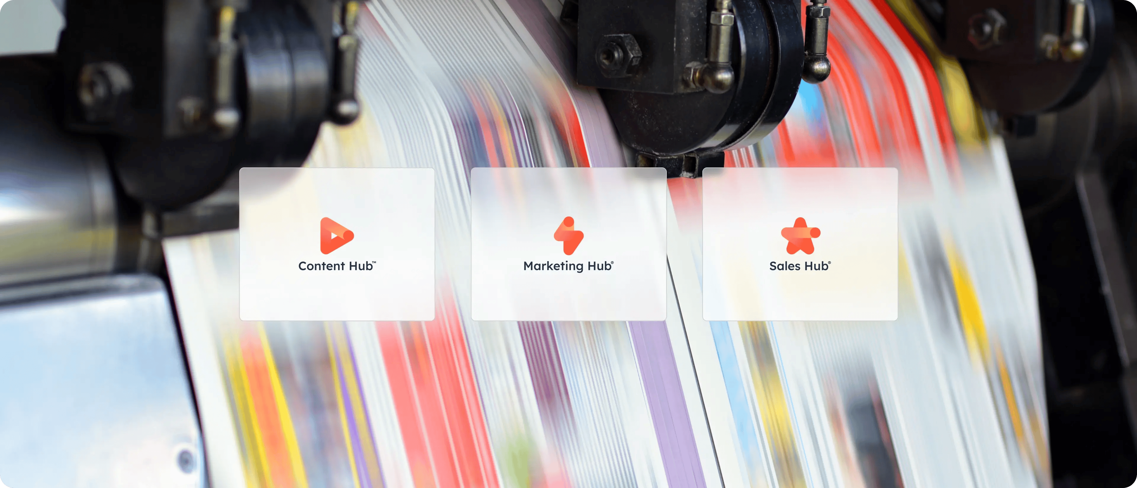 Three HubSpot hub icons: Content Hub, Marketing Hub and Sales Hub are displayed on a textured print background.
