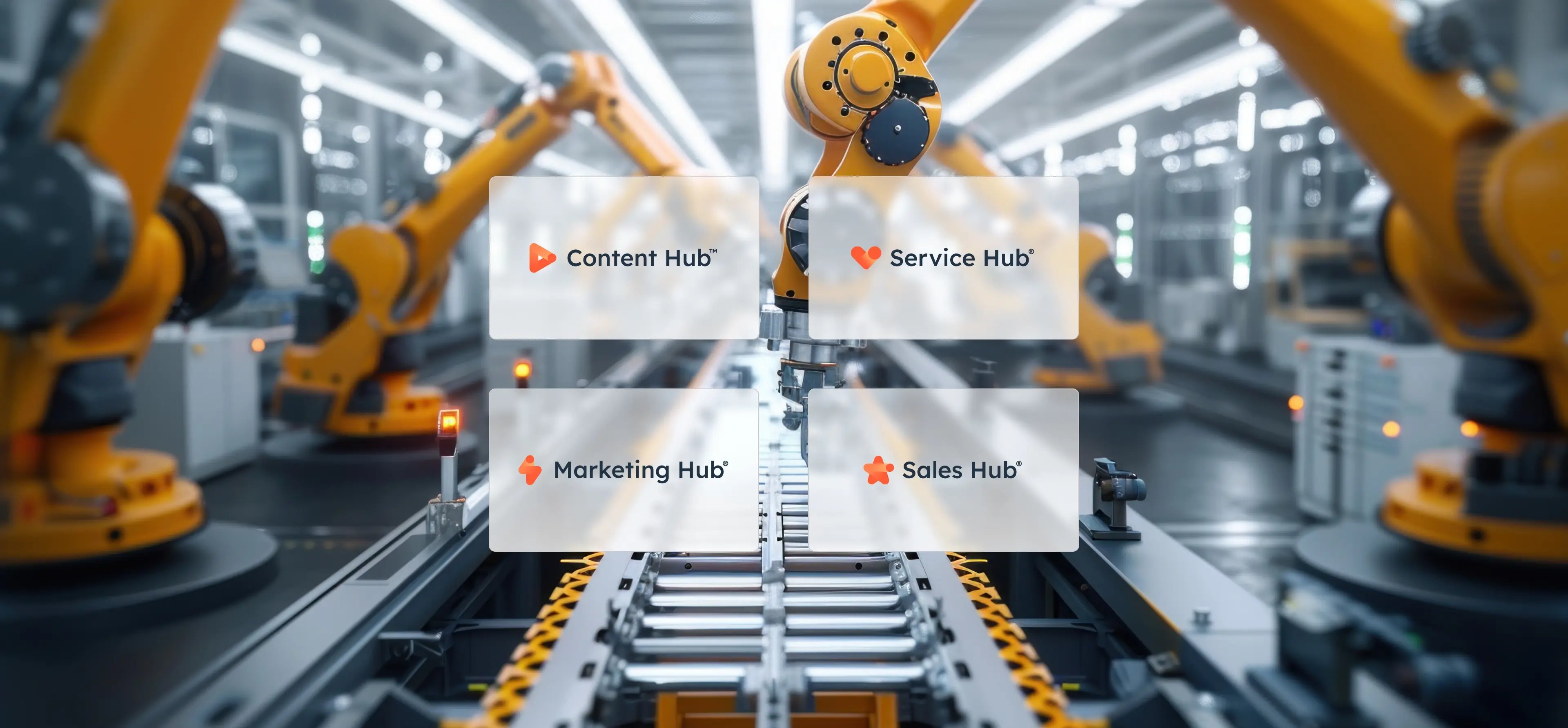 Four HubSpot icons: Content Hub, Marketing Hub, Service Hub and Sales Hub on a modern factory floor with robotic arms.